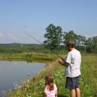 Guests fishing in the farm pond.