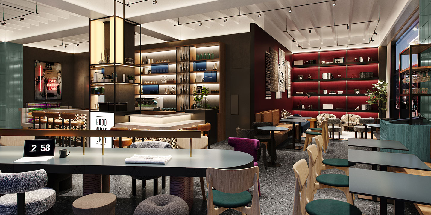 Modern hotel interior with sleek shelves displaying decor items, cozy seating, neon sign reading "EAT SLEEP LIVE," and a bright "GOOD VIBES ONLY" sign.