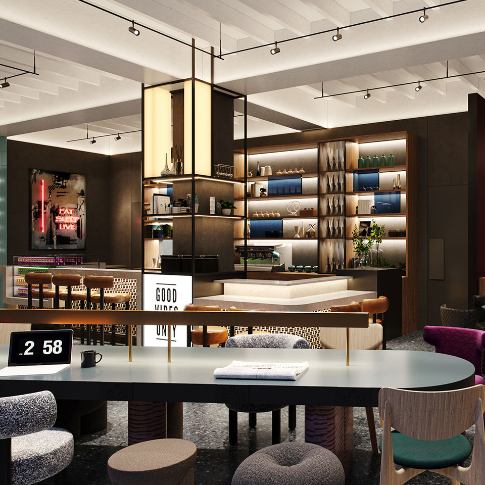 Modern hotel interior with sleek shelves displaying decor items, cozy seating, neon sign reading "EAT SLEEP LIVE," and a bright "GOOD VIBES ONLY" sign.