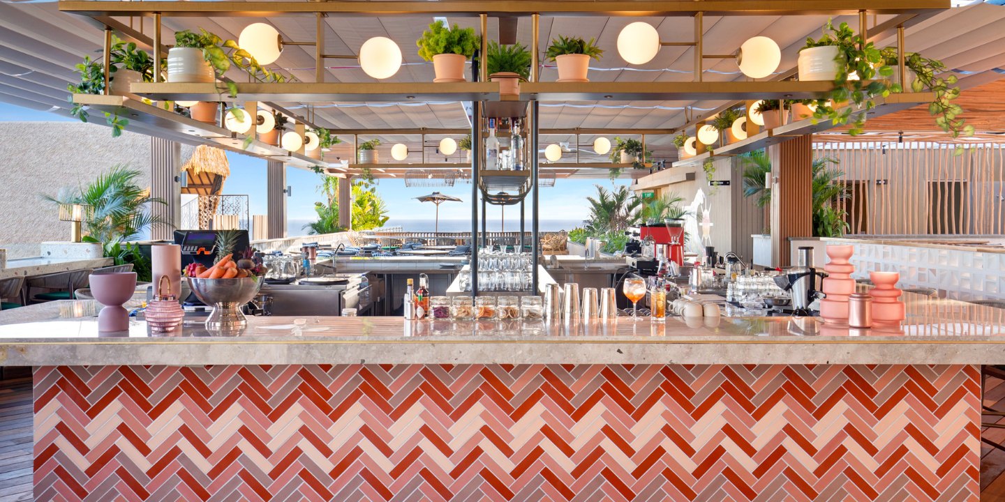 Bar with colourful tiles in red tones.