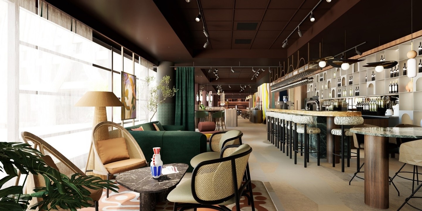 Chic lounge with stylish seating, green accents, a marble table, and contemporary art, creating a warm, inviting atmosphere.