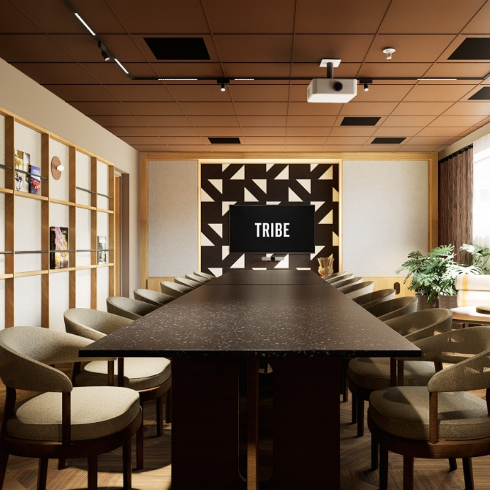 A meetingroom in boardroom setup with a wall mounted tv. The colour scheme is defined by earth tones.