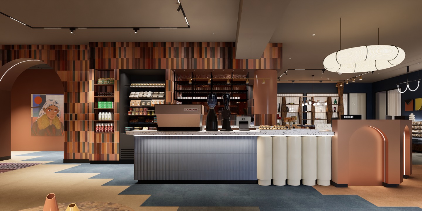 A front desk, which also serves as a bar with a coffee machine and a fridge with fresh food.