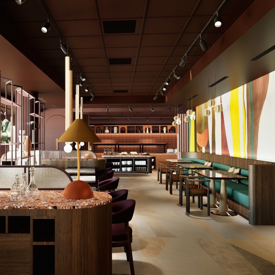 Chic lounge with stylish seating, green accents, a marble table, and contemporary art, creating a warm, inviting atmosphere.