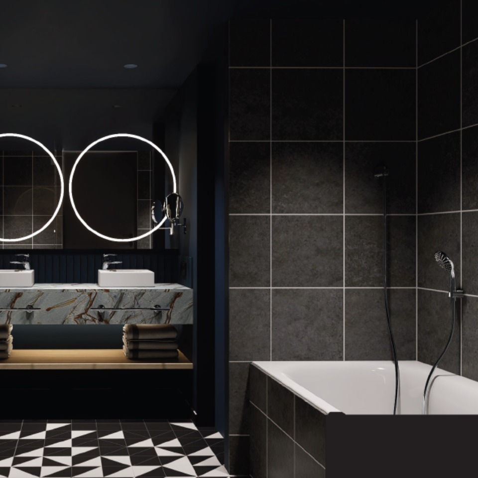 A bathroom with dark tiles and a bathtub.