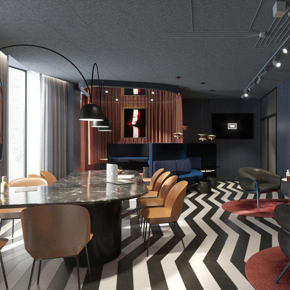 Stylish modern workspace featuring a large marble table, brown chairs, blue seating areas, and artistic decor with zigzag flooring.