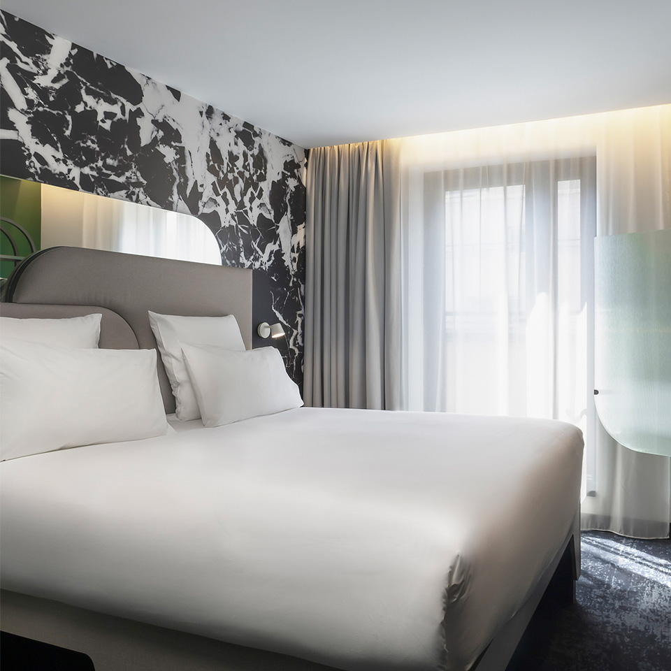 Double bed with white linen