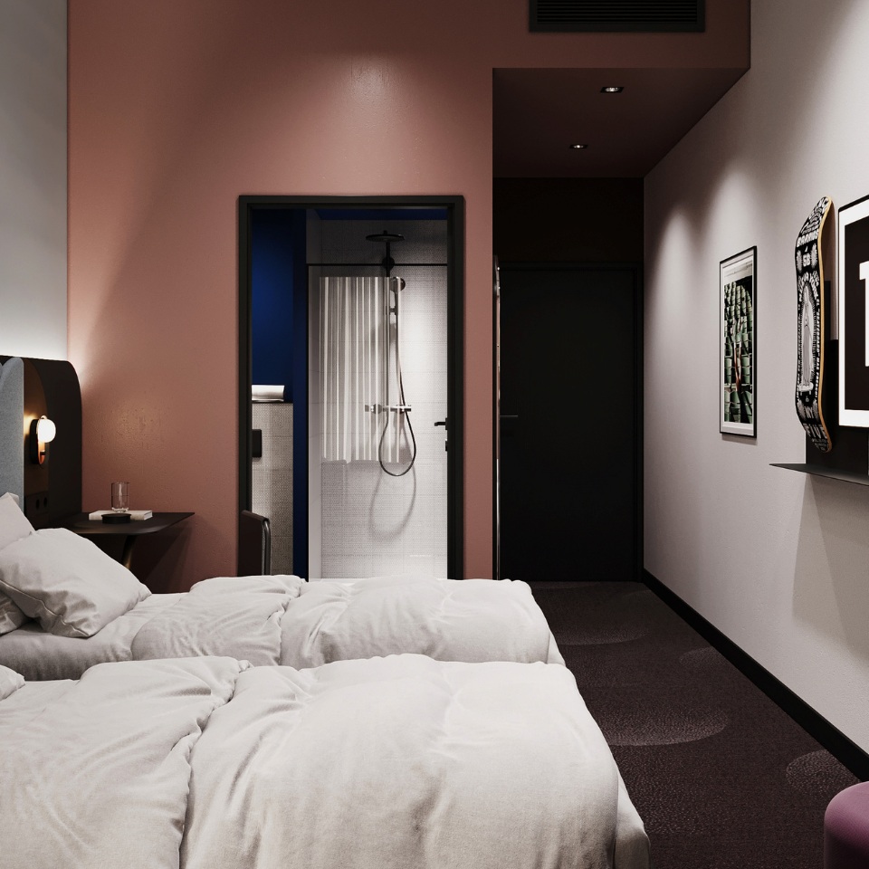 Cozy hotel room featuring two beds, modern fixtures, and a stylish en-suite bathroom with a shower behind a glass partition.