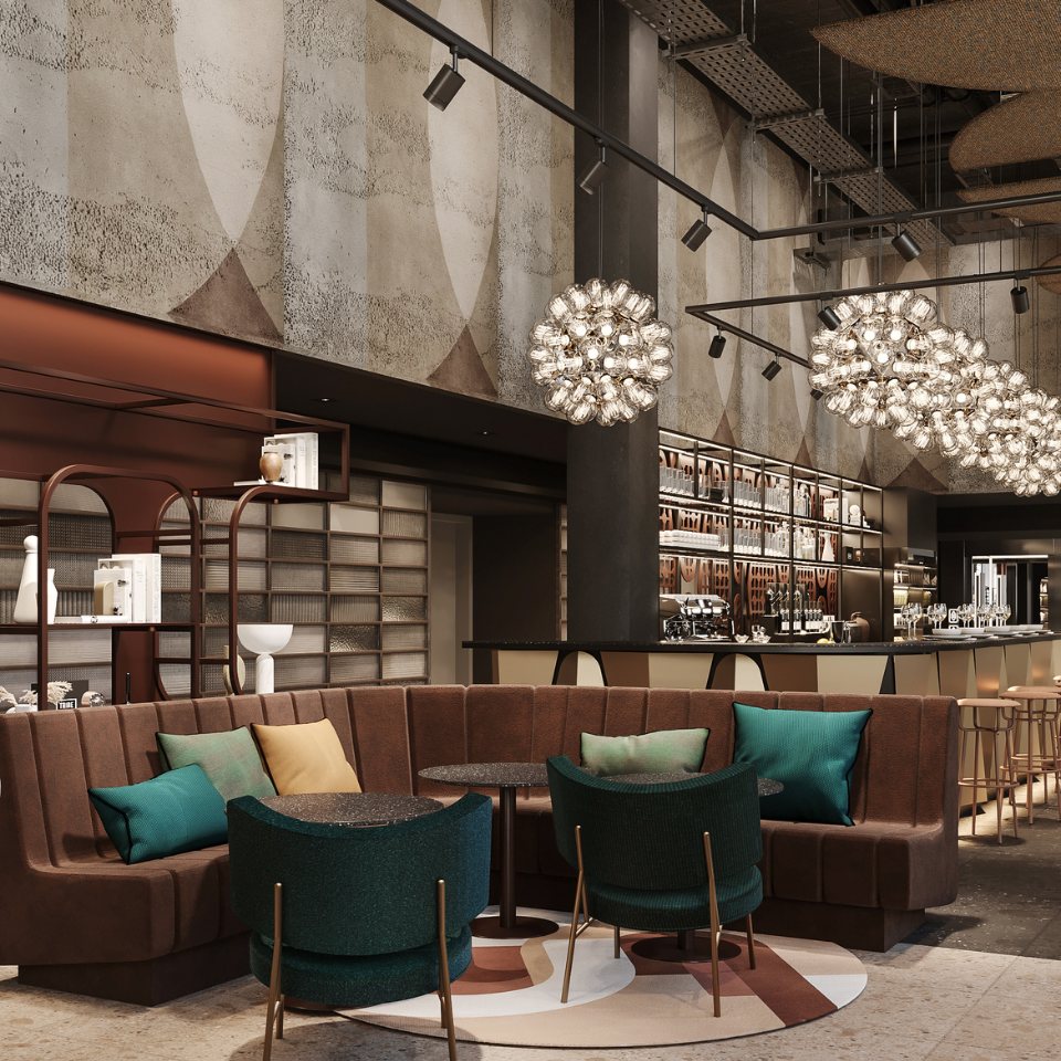 Hotel lobby featuring cozy seating with colorful cushions, unique lighting fixtures, and a chic bar area in soft tones.