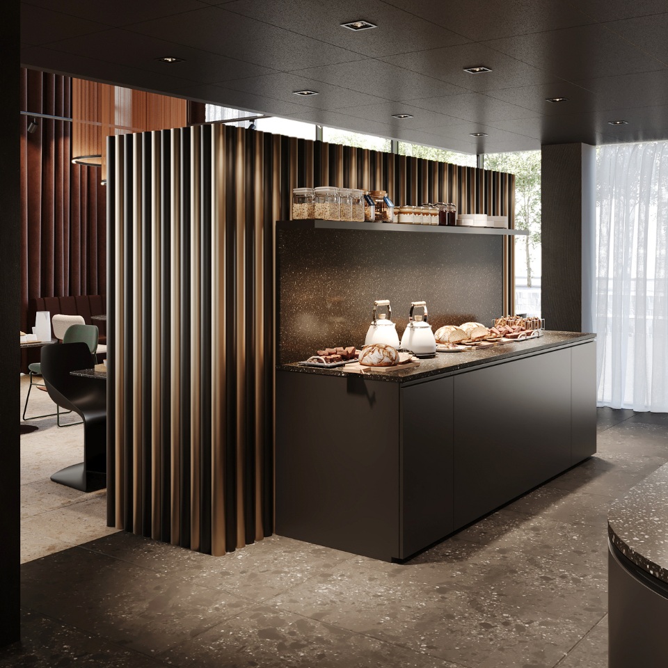 Modern kitchen design featuring a sleek counter with baked goods, glass jars, and stylish lighting behind a decorative wall.