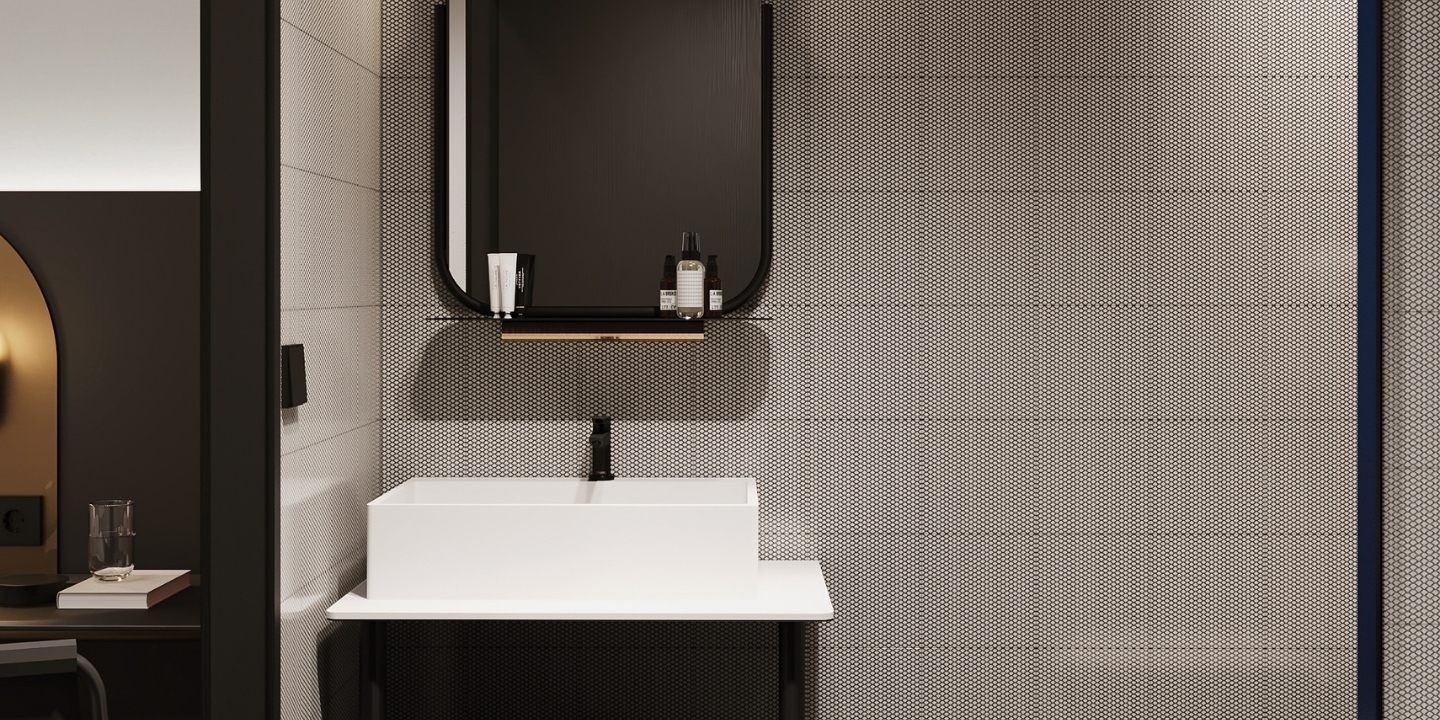 Modern bathroom featuring a sleek white sink, stylish mirror, and black accents against textured gray walls, illuminated by blue ceiling light.