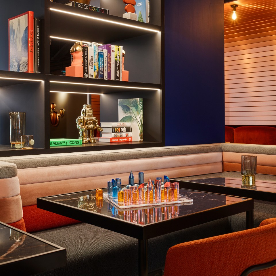 Social Hub with colourful couches and decorations in the shelves