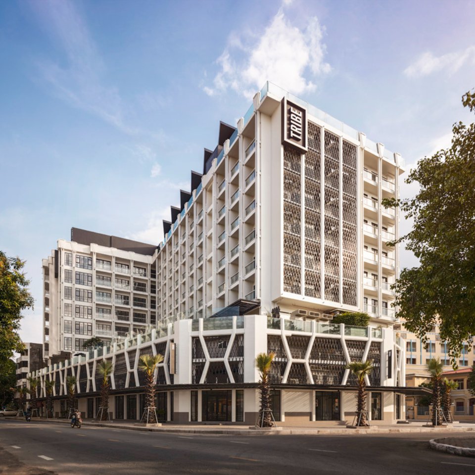 Exterior view of TRIBE Phnom Penh, a tall white building