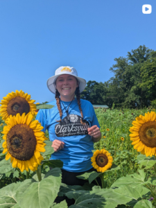 Woman in field of sunflowers